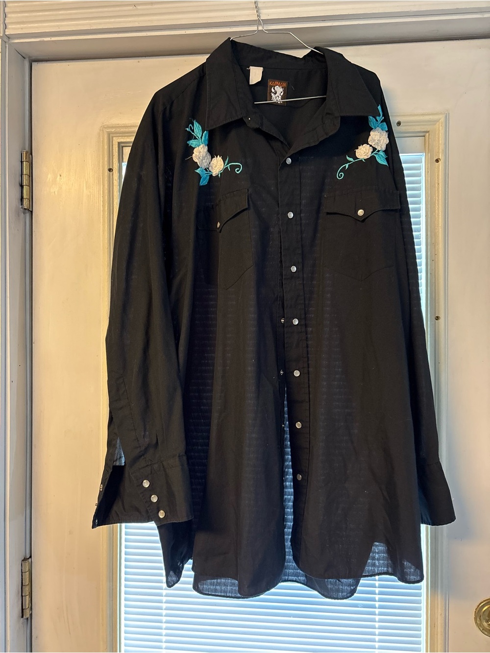 Karma Black Shirt with Orange Logo and White Embroidered Crest